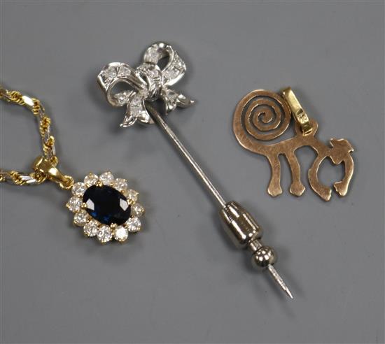A sapphire and diamond oval cluster pendant, 18ct gold suspension, a gold monkey pendant and a white metal bow pin
